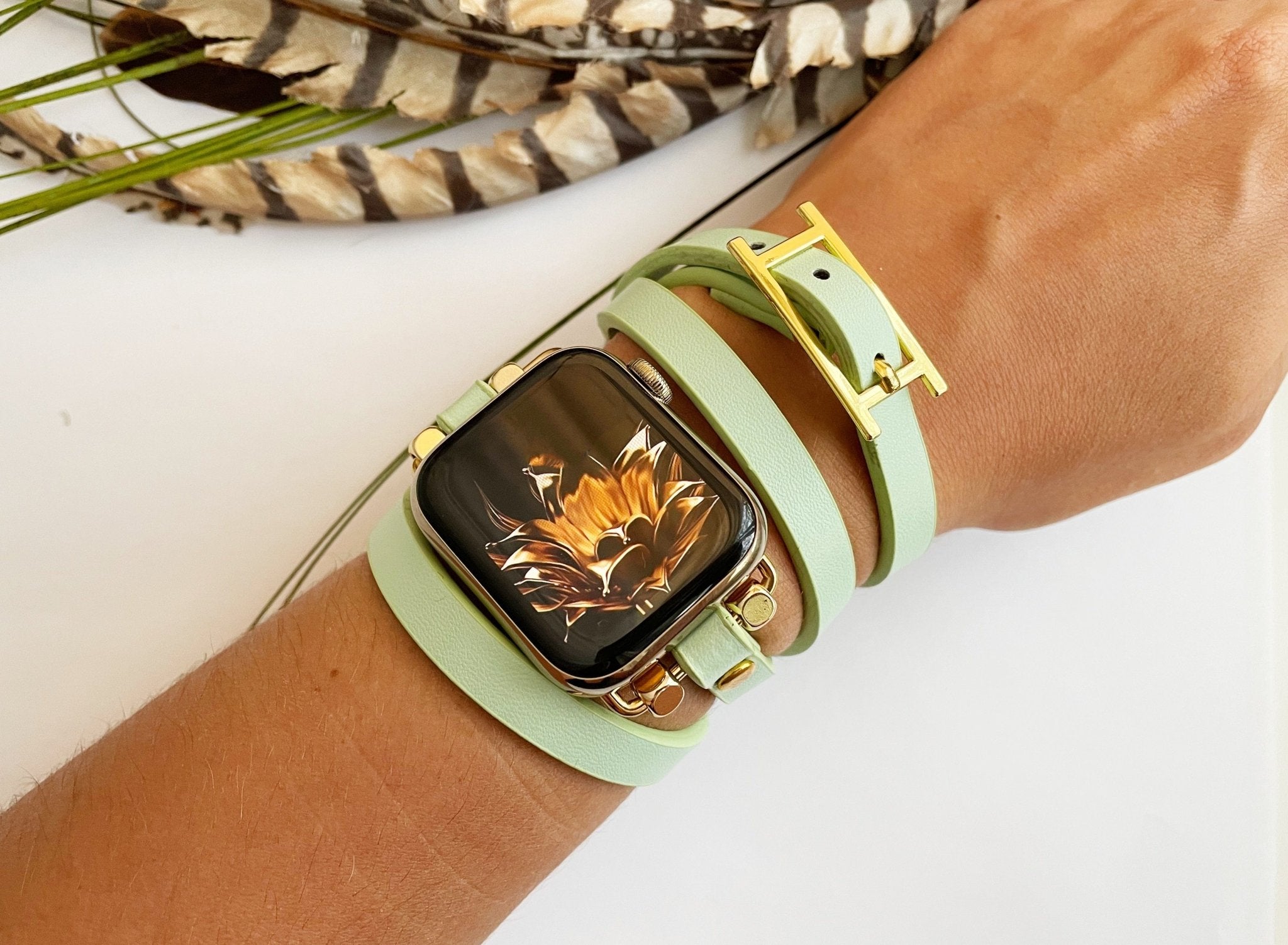 mint green apple watch band with gold buckle